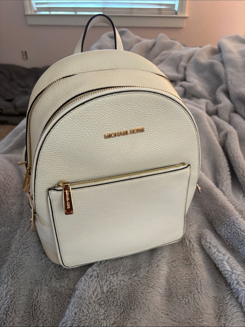 Like new!! Michael Kors Cream Pebbled Leather Mini Backpack with Gold Hardware